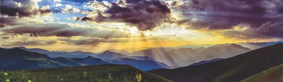 Sunset over rolling hills.