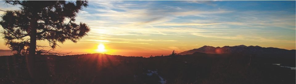 Sunset over a mountainous landscape.